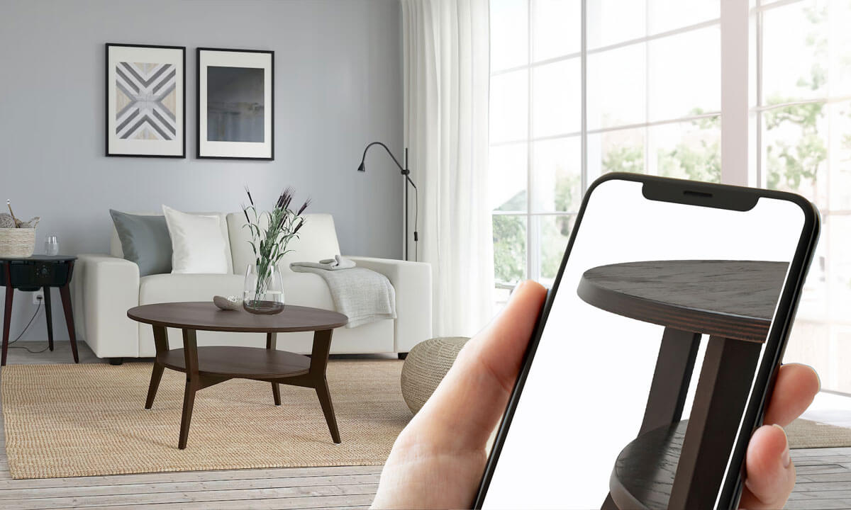 Smartphone using visual search to match a round wooden side table in a cozy living room setup, demonstrating the ease of finding furniture online.