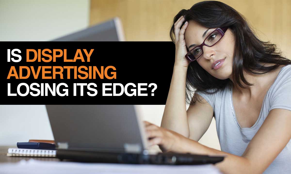 Hero image: Frustrated woman questioning the effectiveness of display advertising, with text overlay 'Is Display Advertising Losing Its Edge?