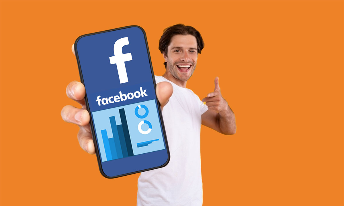 Smiling man holding smartphone with Facebook analytics, representing personalized social media marketing services.