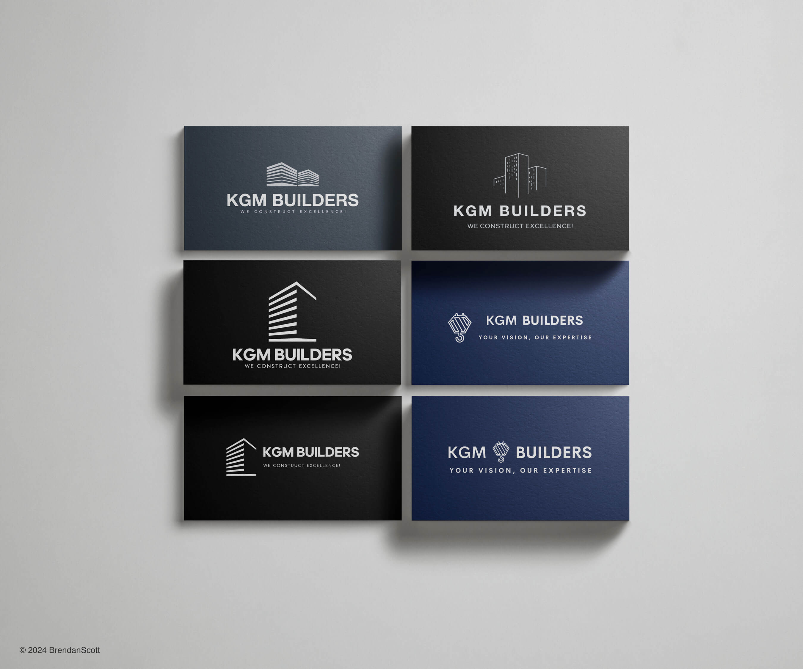 KGM Builders business cards in various designs, showcasing the company's branding.